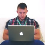freelancer typing on notebook