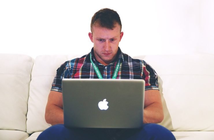 freelancer typing on notebook