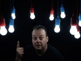 man shows light bulbs